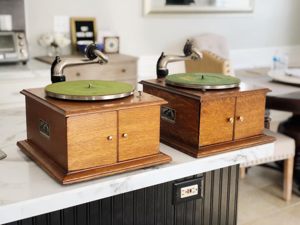 Two Victor Victrola tabletop talking machines with green turntable felts side by side