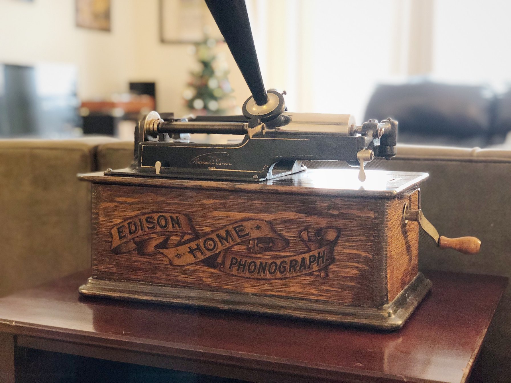 Edison Home Phonograph in an oak case with banner decal, restored by a WIMAPS member